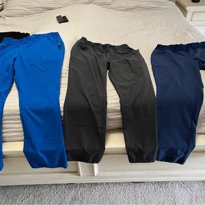 2 black and 1 royal blue scrubs listing